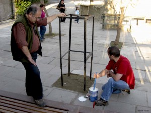 Jaime wonders whether Andy will paint the stand or the sidewalk.